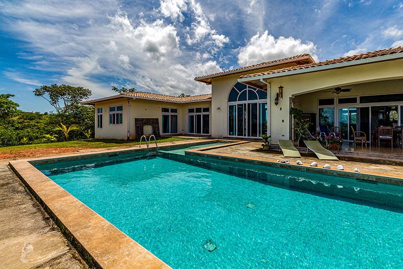 a mansion with a swimming pool